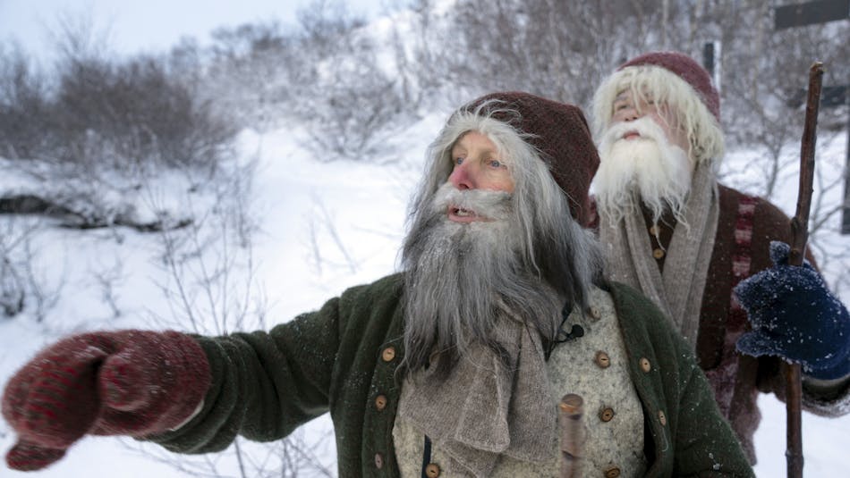 two bearded figures prowling in the snow