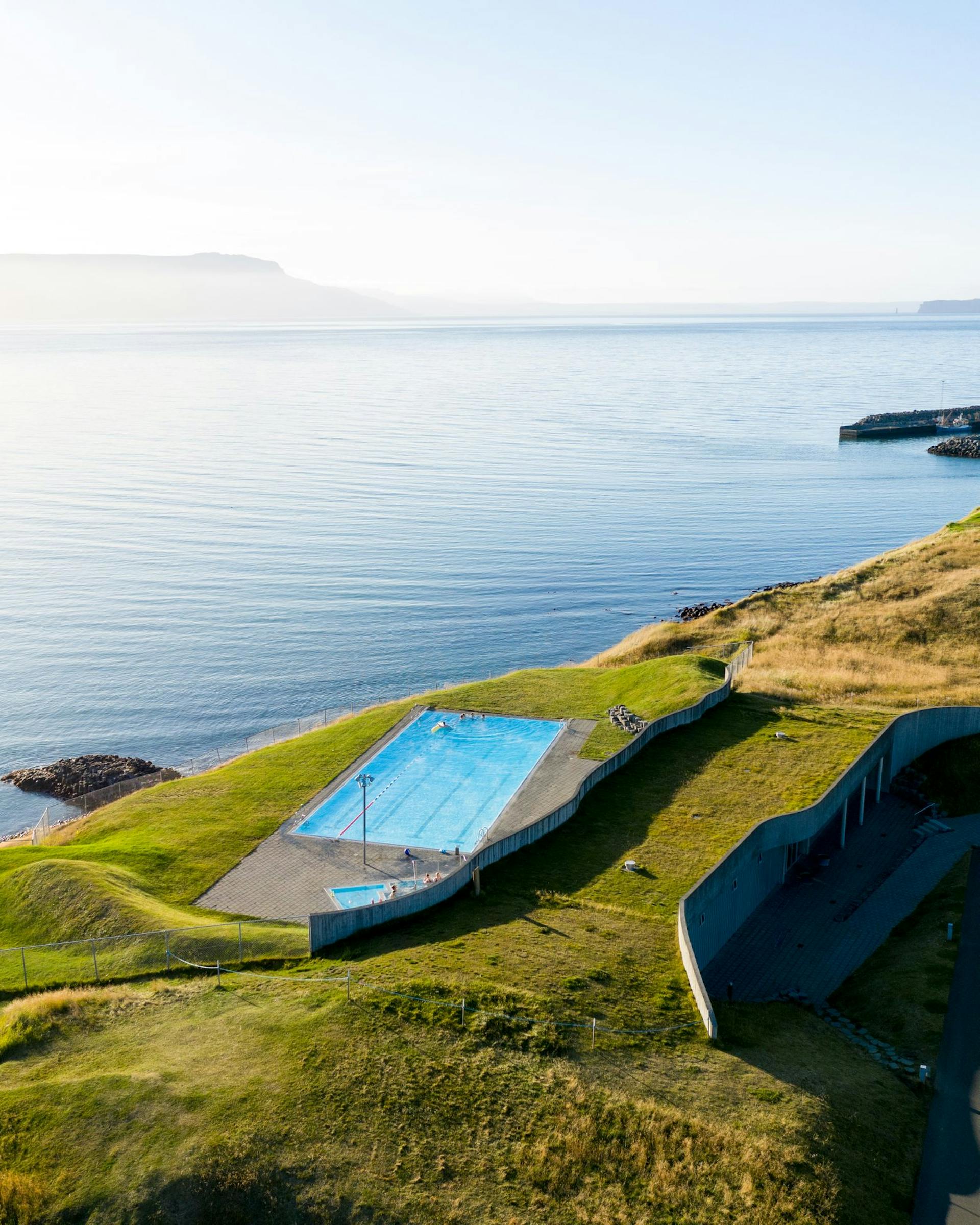 A swimming pool by the ocean overlooking the Fjord