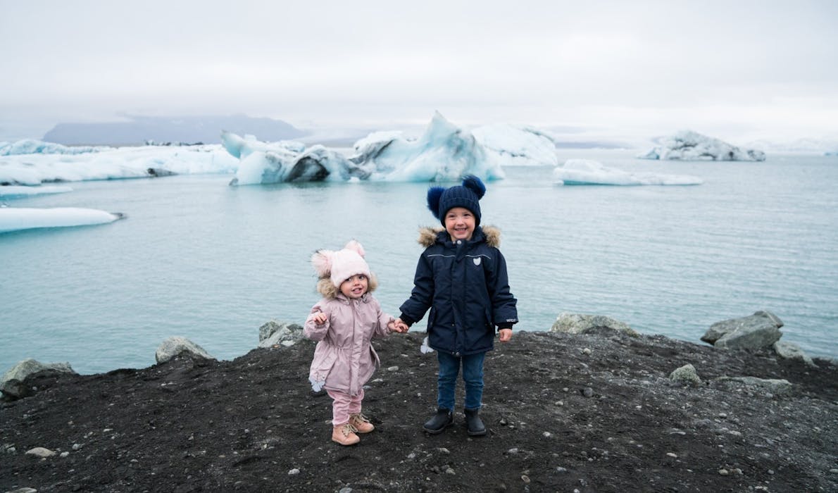 Two children at the Glacier Lagoon in Iceland.
