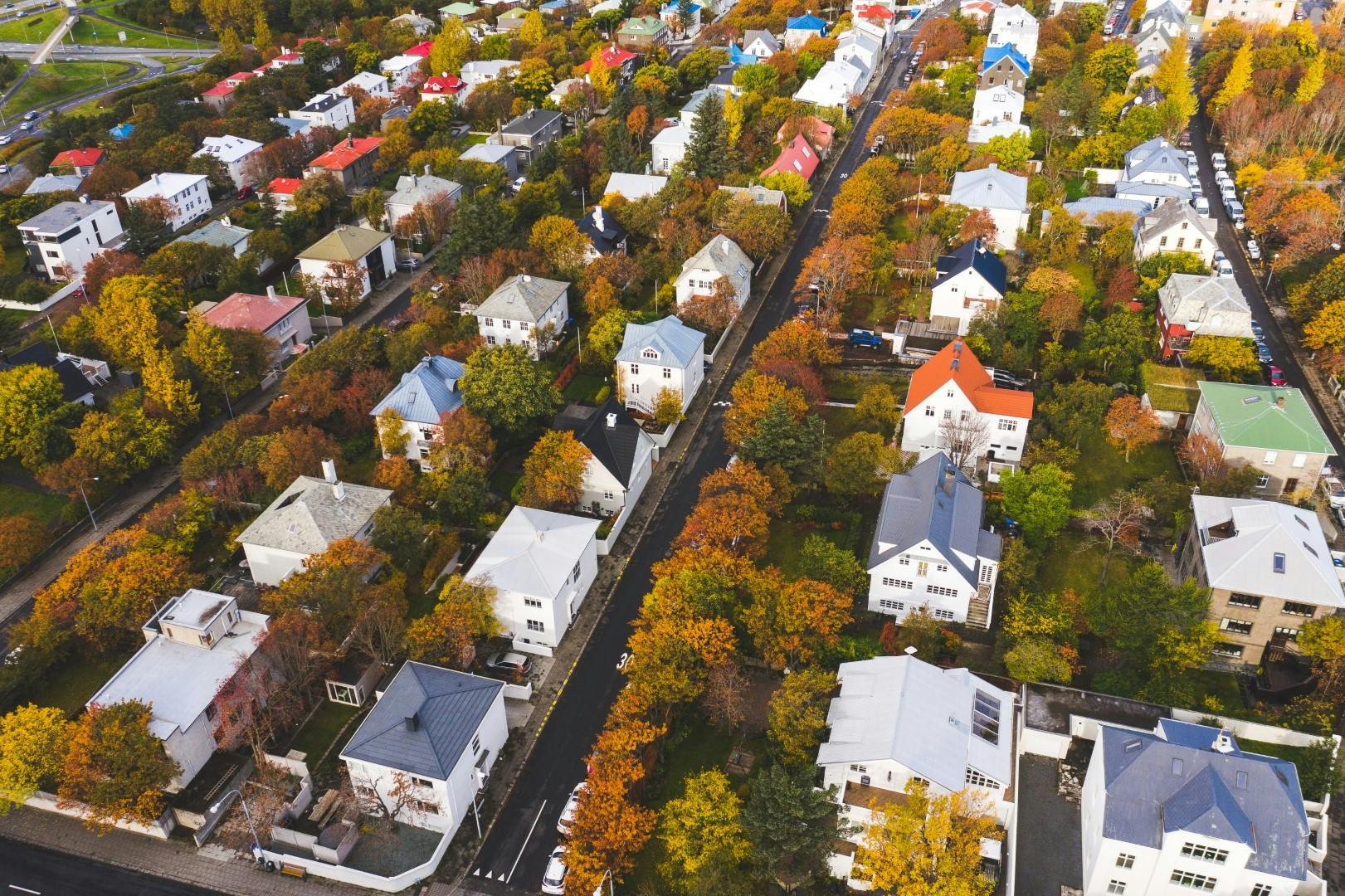 Colorful houses surrounded by trees in Reykjavik, seen from above