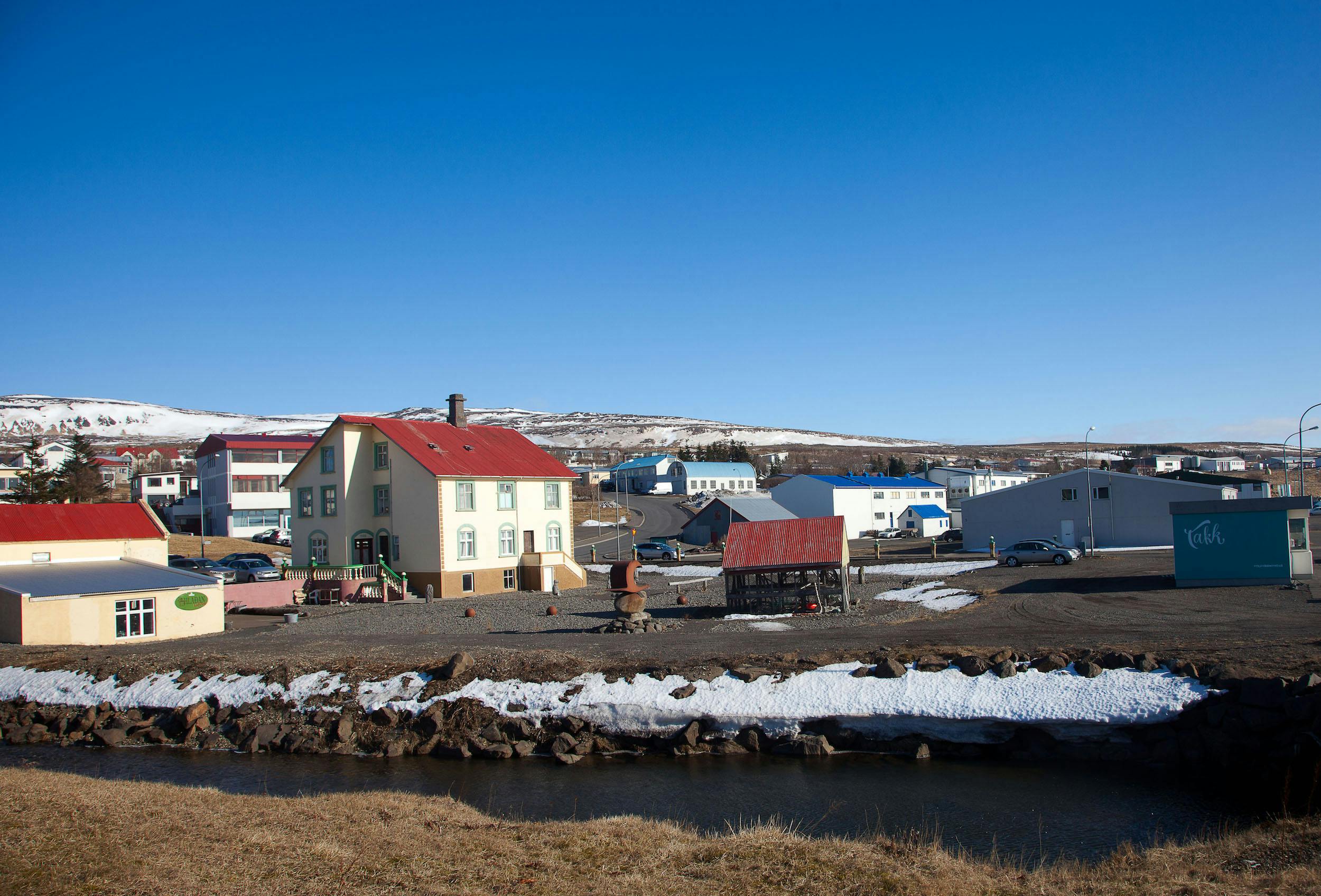 Hvammstangi harbour with its yellow houses on a cold winter morning
