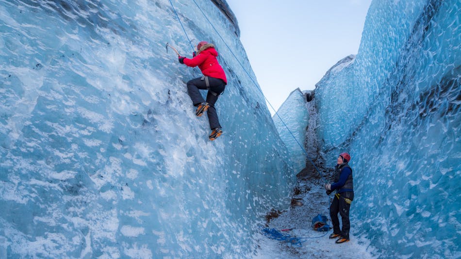 People Ice climbing