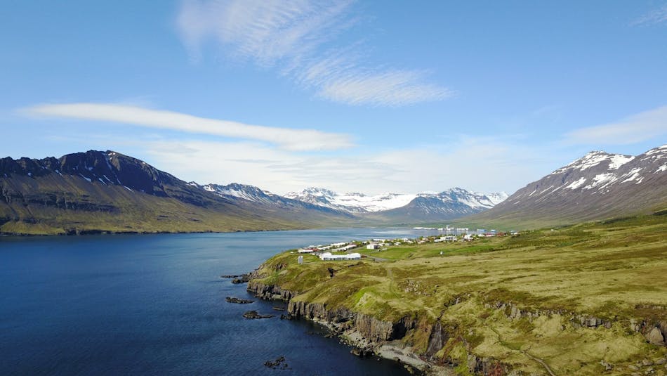 Overlooking a rugged coastline with a small town on the shore