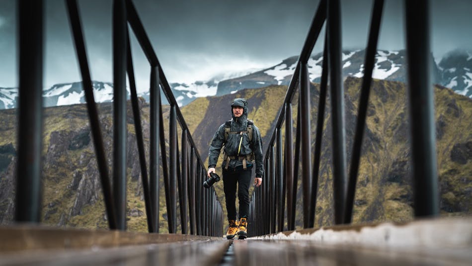 Man hiking in Iceland with a camera in his hands