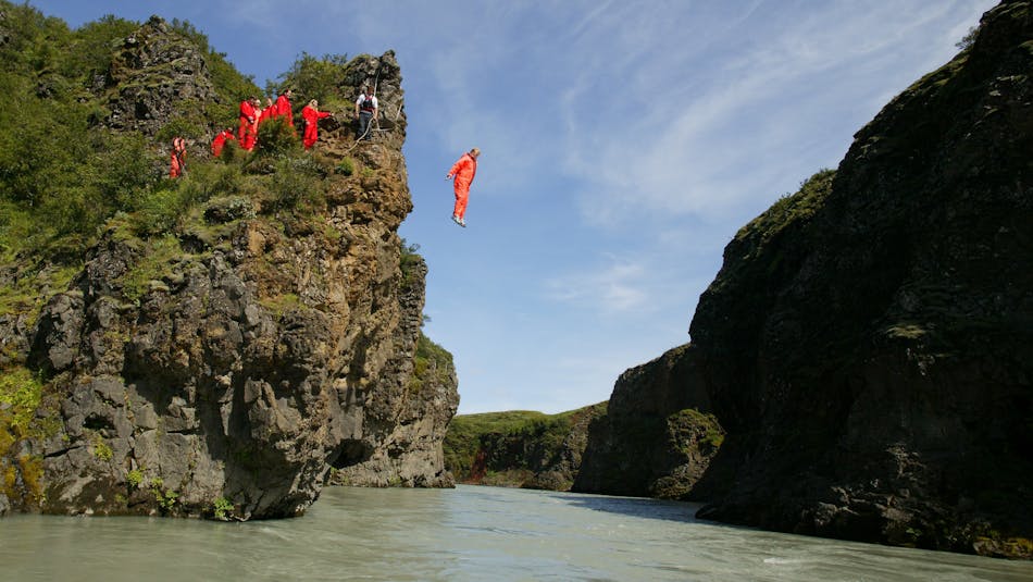 Cliff jumping on West Glacial River, Iceland