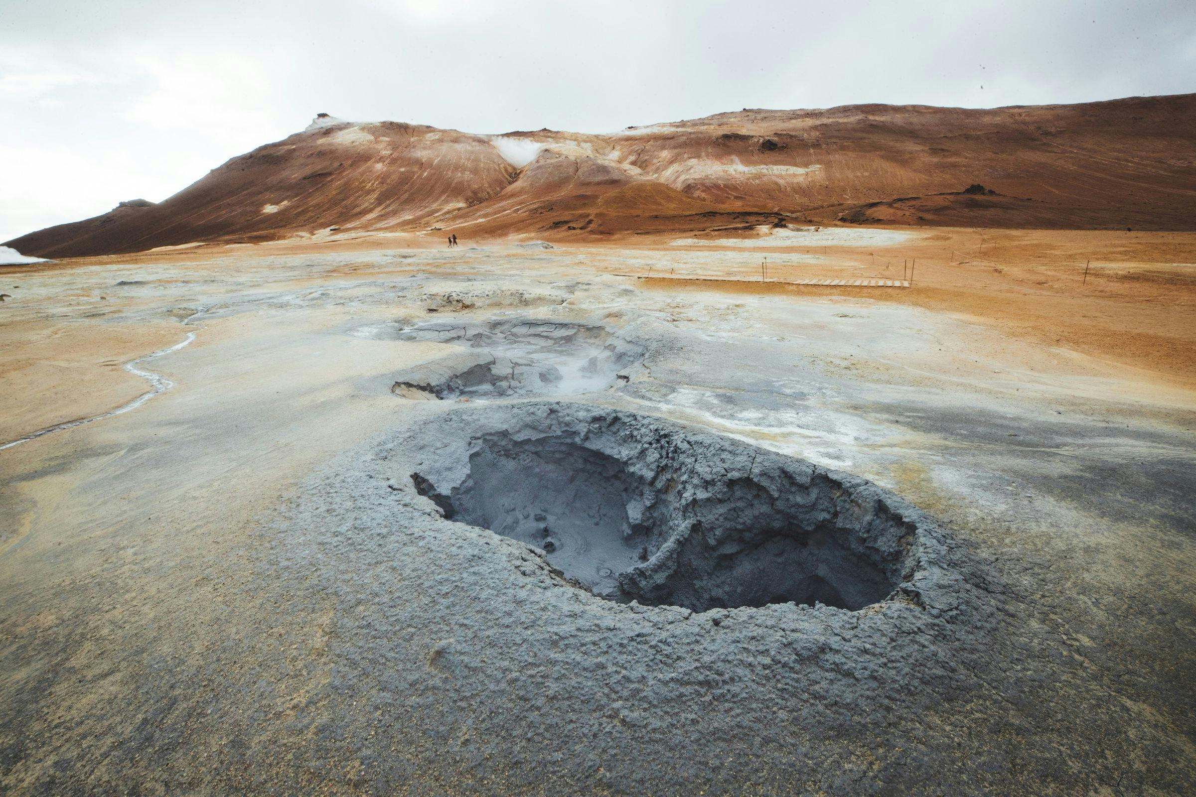 Boiling grey and yellow mud