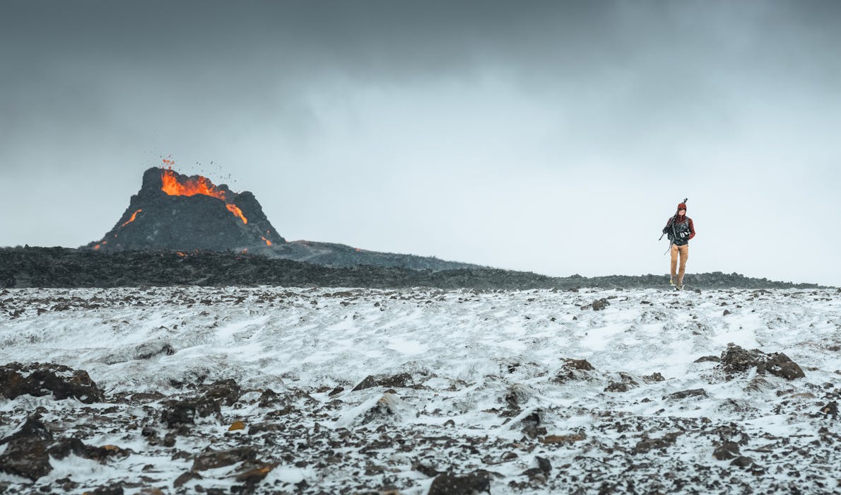 Man walking away from Fagradalsfjall volcano. Photo Credit: Thrainn Kolbeinsson
