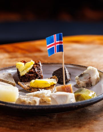 Traditional Icelandic meal with a small Icelandic flag in the middle