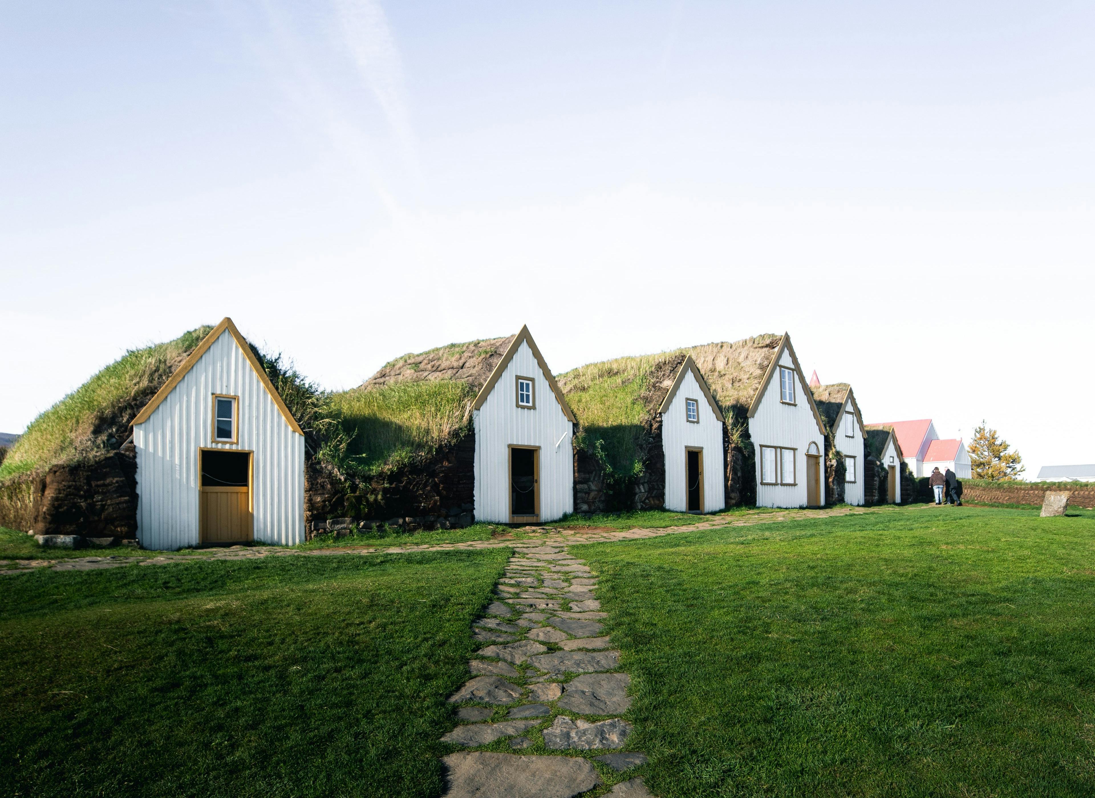 Sod houses with white wooden front