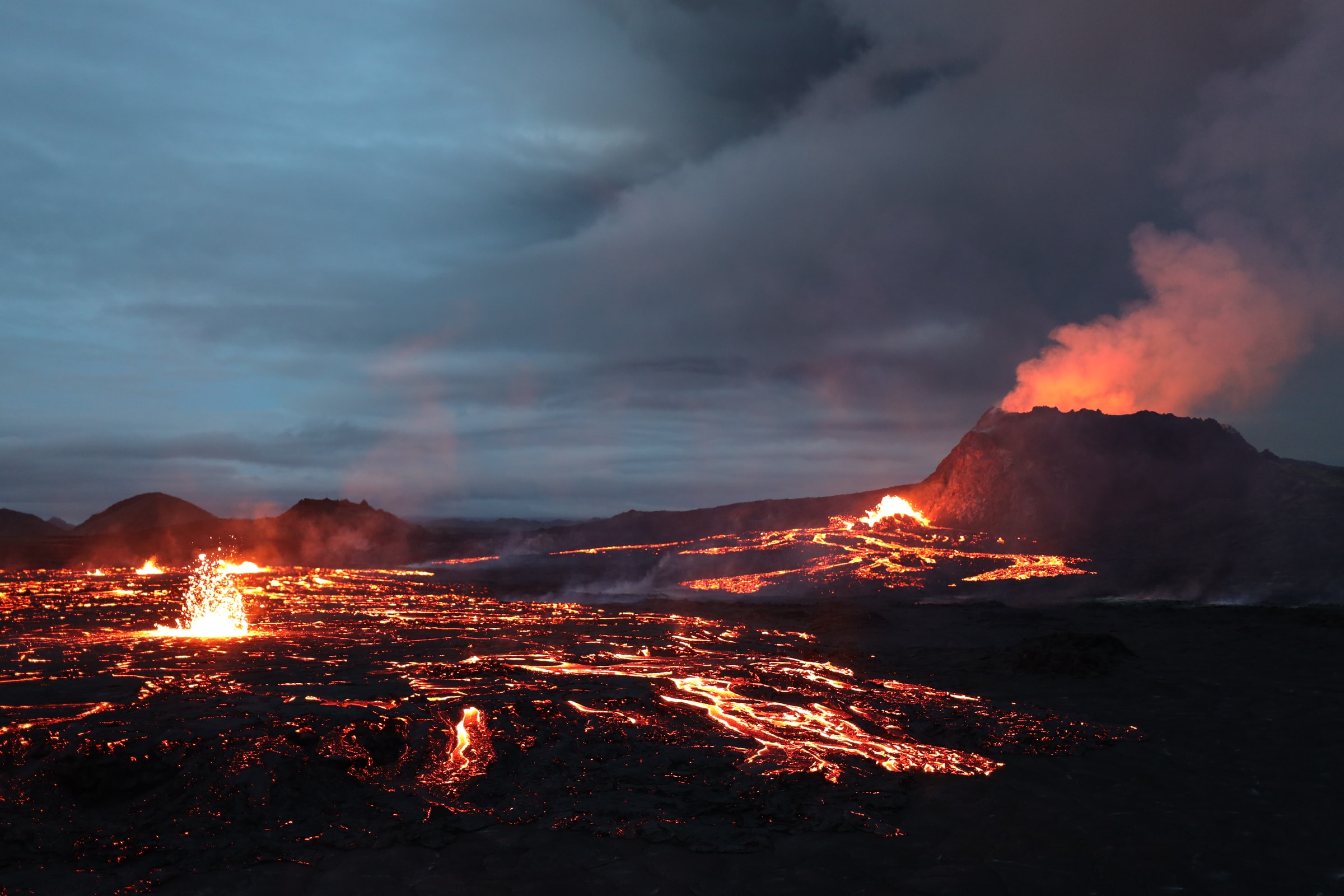 Erupting Crater And Flowing Lava