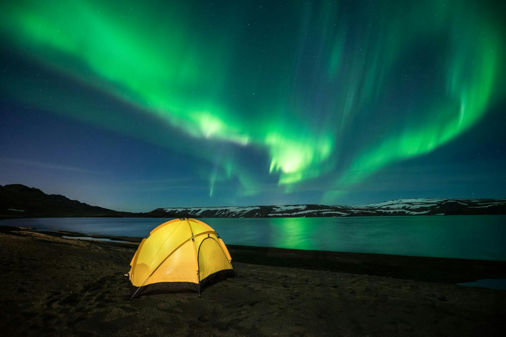 yellow tent under green northern ligths