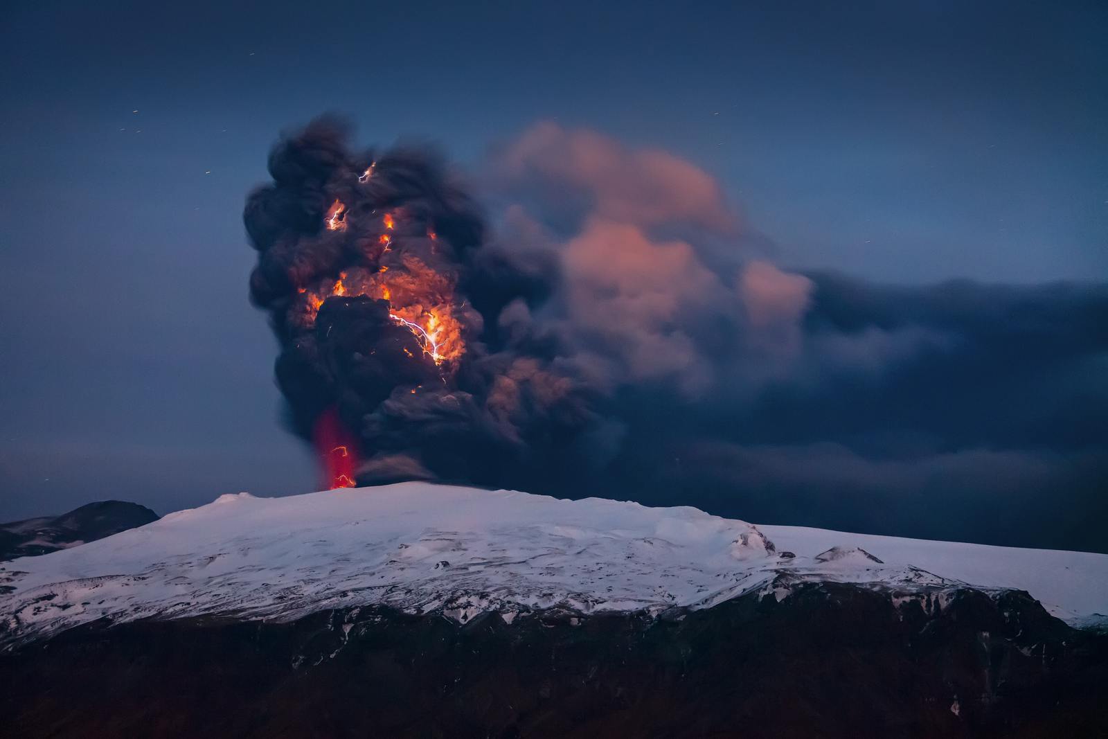 Ash plume with lightnings rising from Eyjafjallajökull volcano in 2010