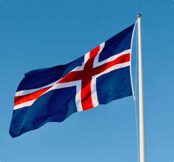 The Icelandic flag with blue sky in the background