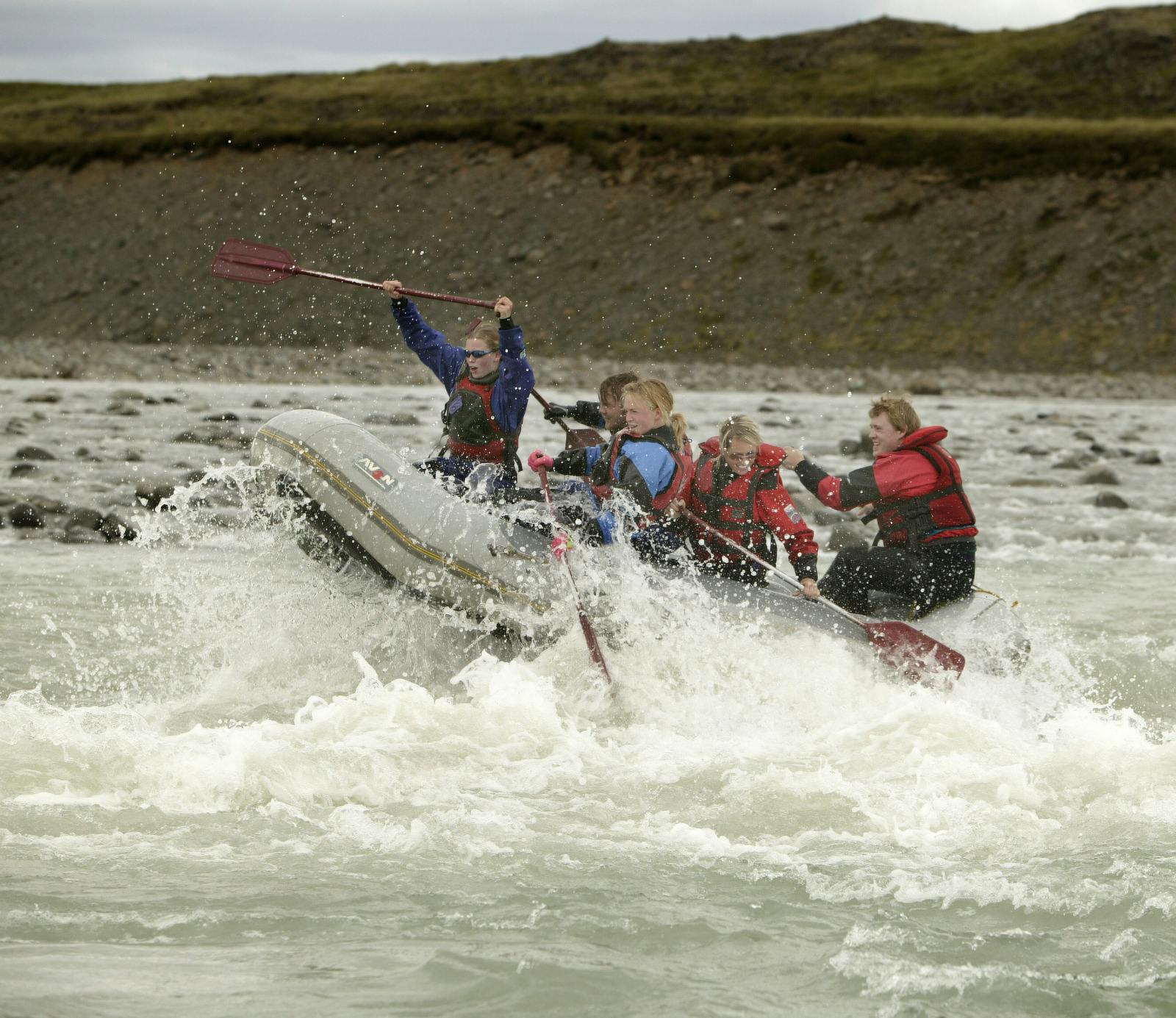 Rafting boat in whitewater rapids 