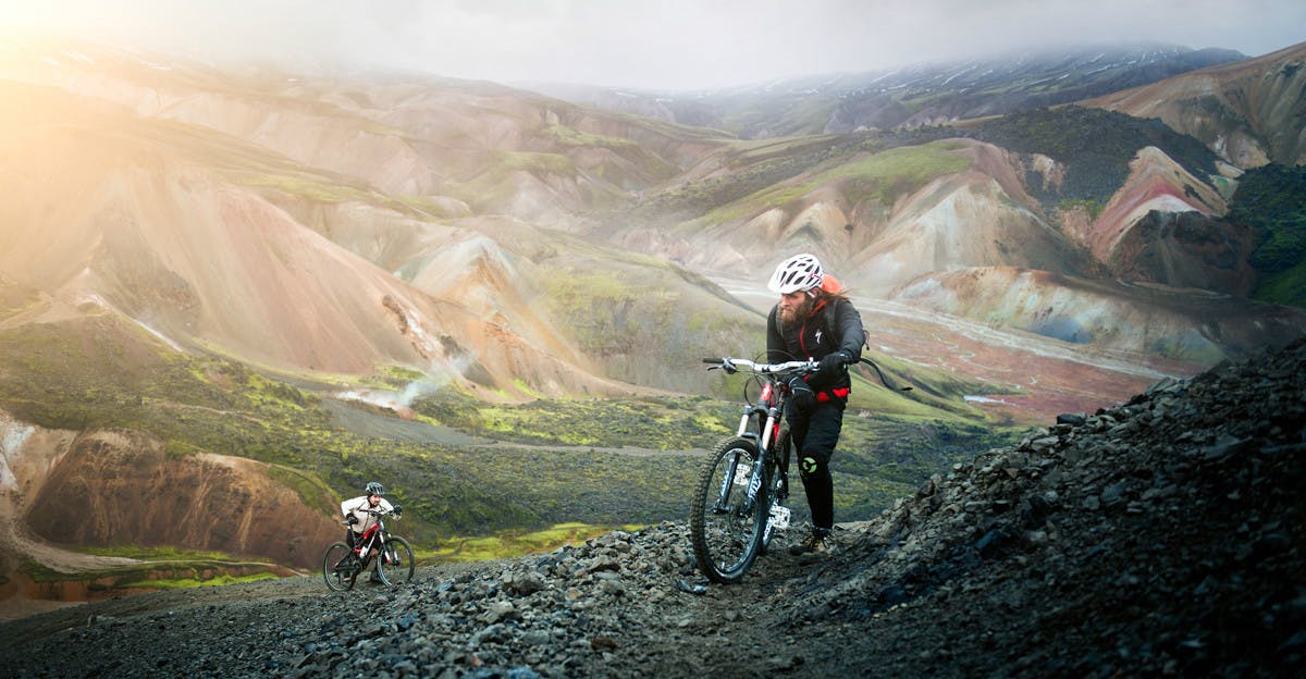 People mountain biking