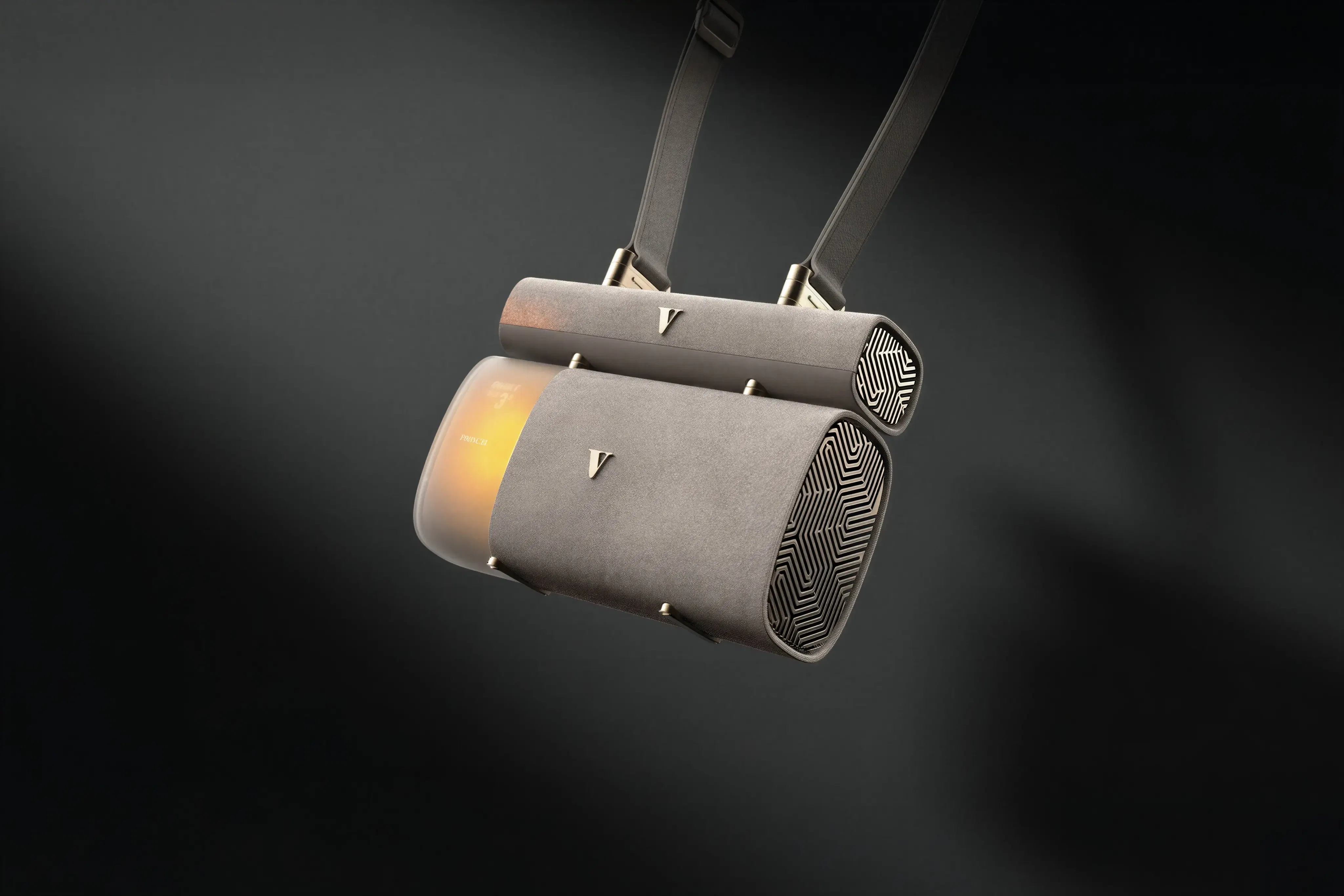 Nexus unit hanging from a carry strap, softly lit against a dark background