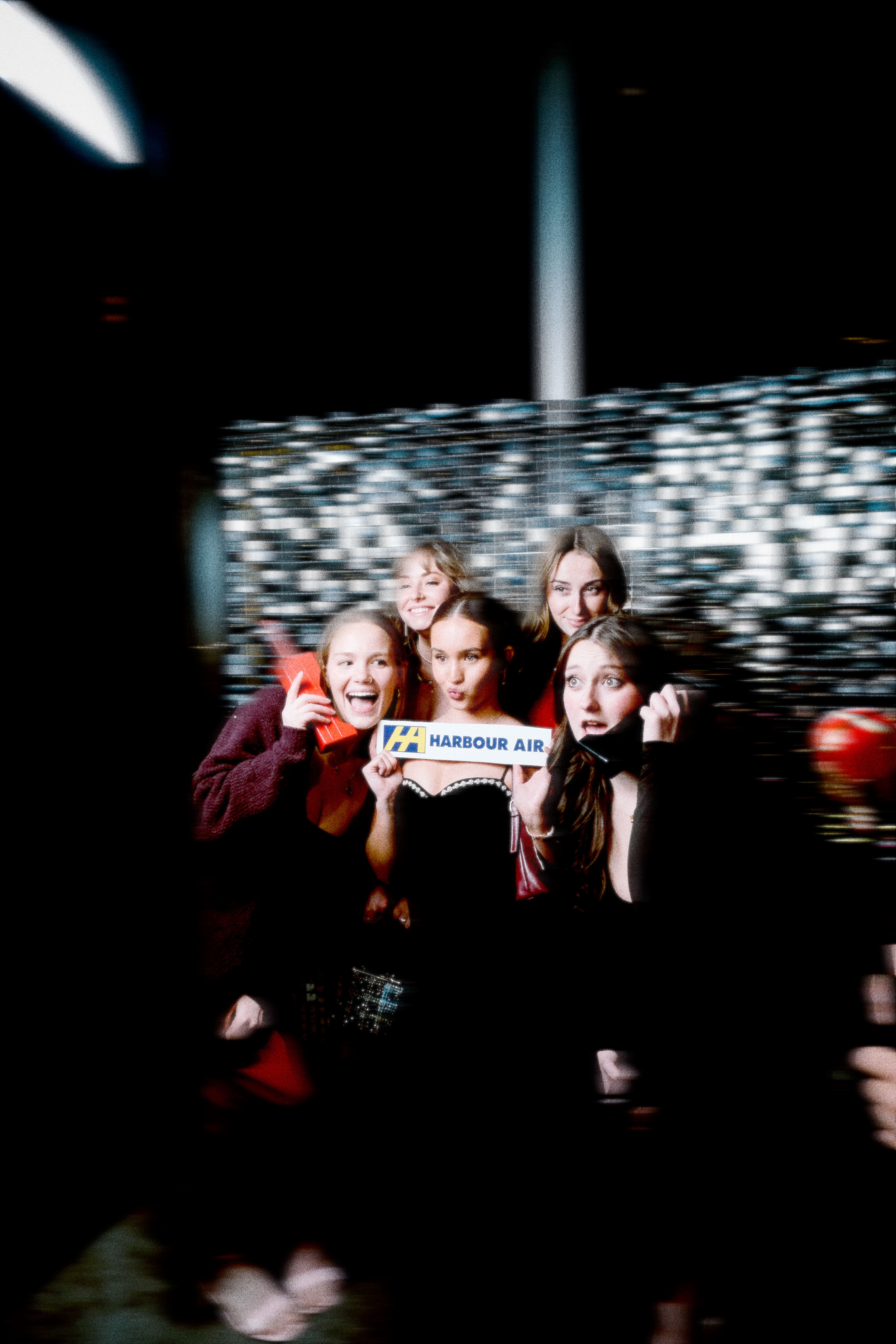 A group of colleagues posing in front of the PhotoBooth
