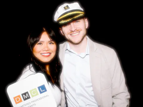 Two colleagues dressed up in costume in a photo