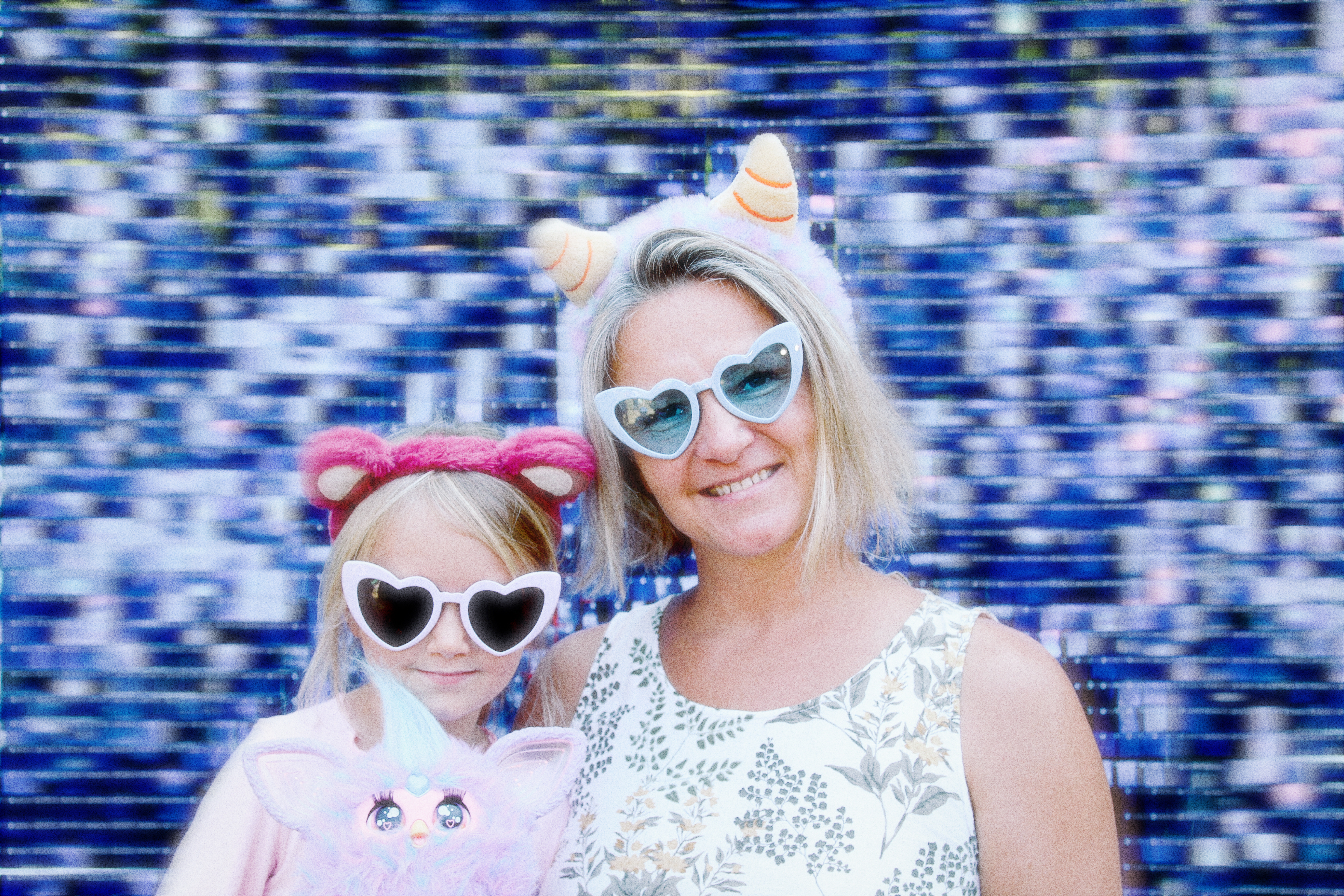 A happy family moment captured in a photo against a sparkling blue background