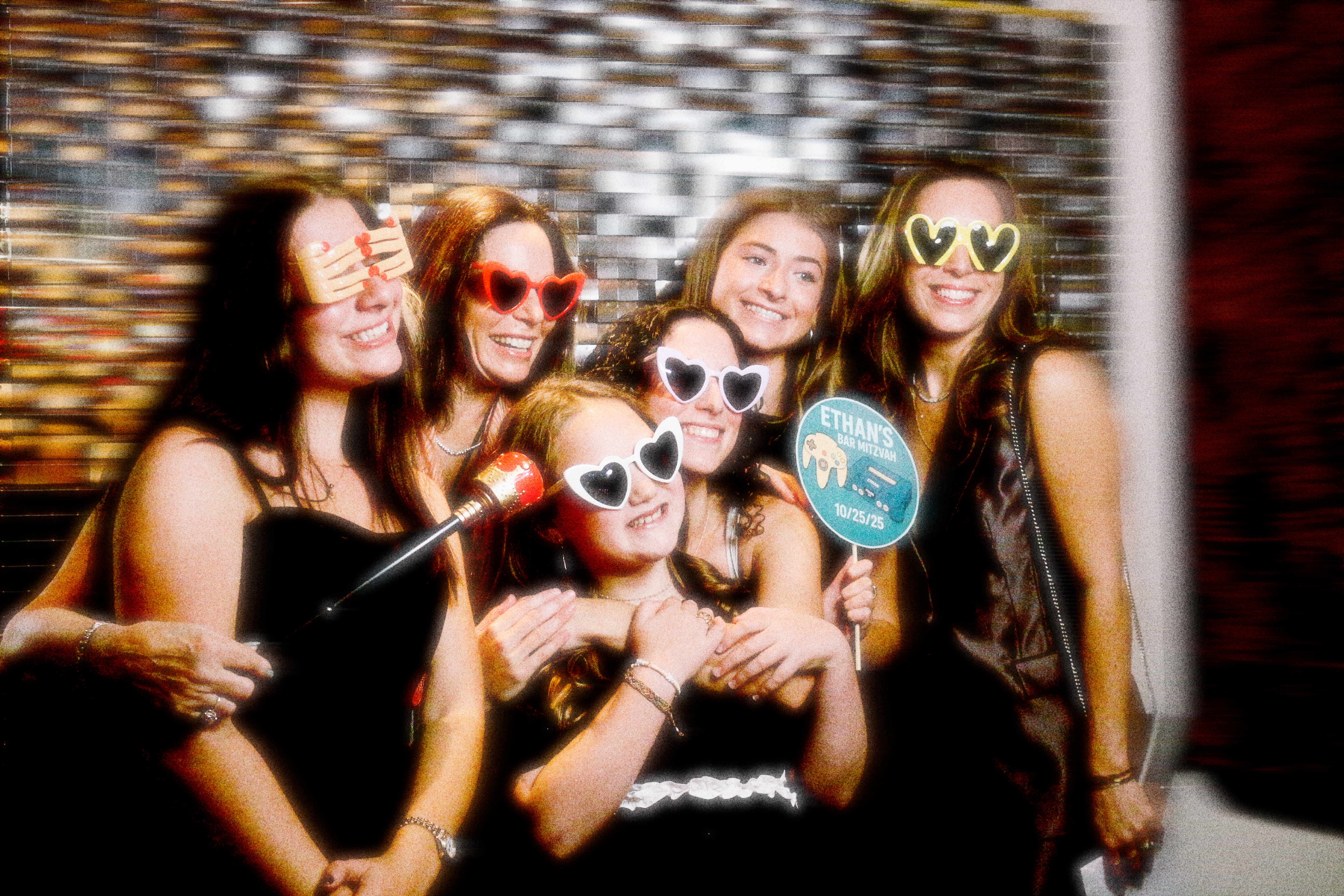 A group of friends and family posing for a private party.