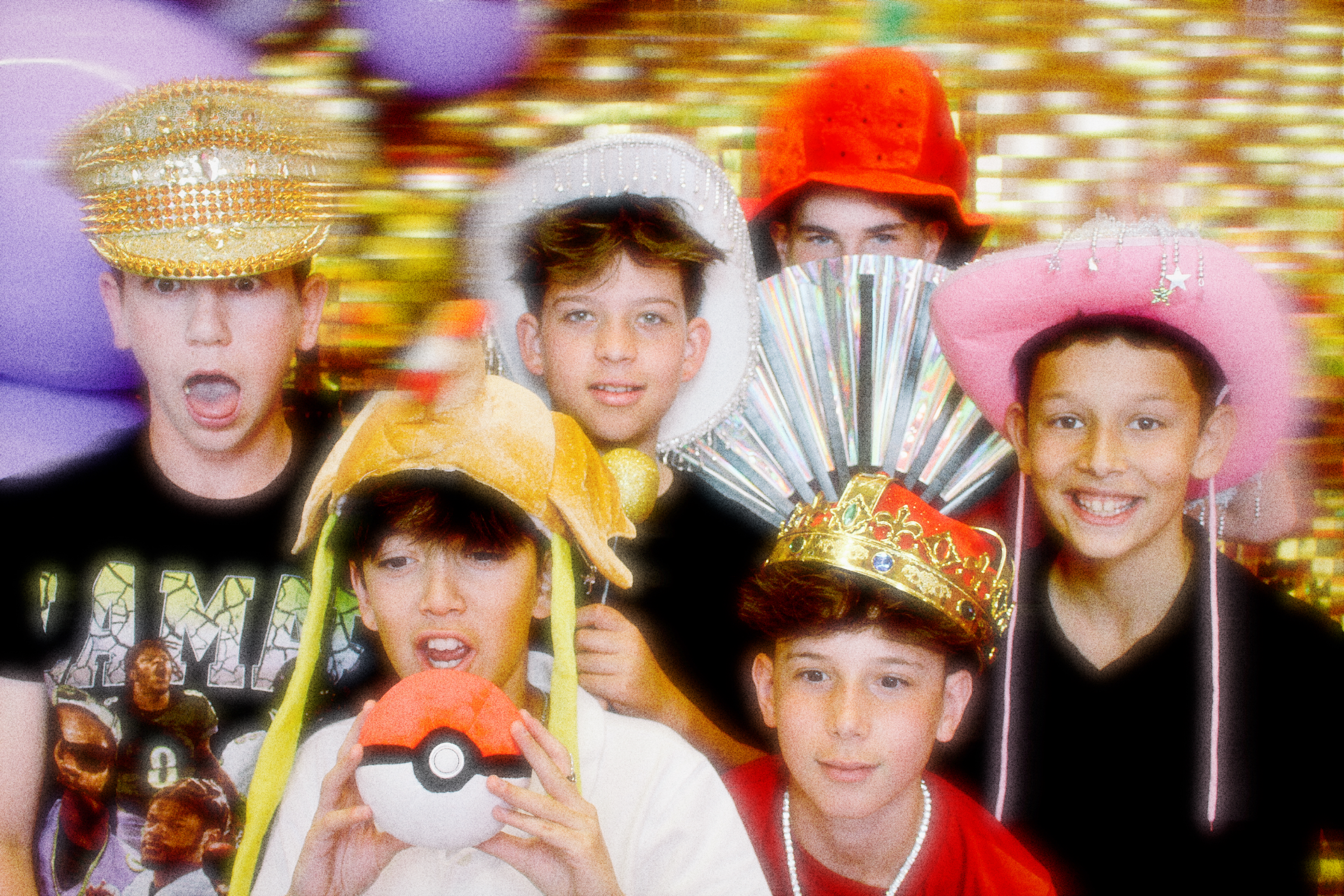 A group of children posing in front of the photo booth for a birthday party.