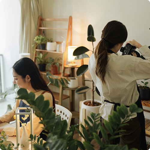 Small business owner using Viva.com Quick Pay to accept online payments without a website while working in a modern home office