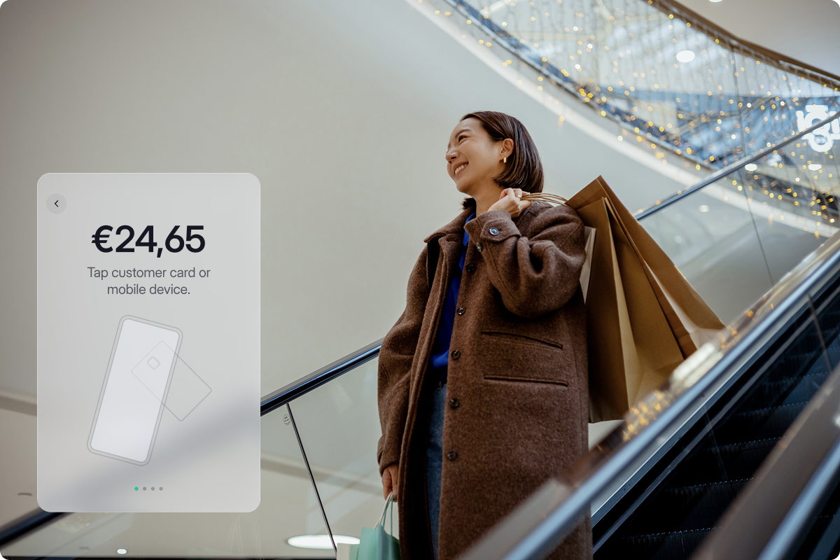 In-person card payment solution — happy shopper in a mall with viva.com Tap on Any Device payment screen overlay, accepting contactless payments across thousands of devices in Europe