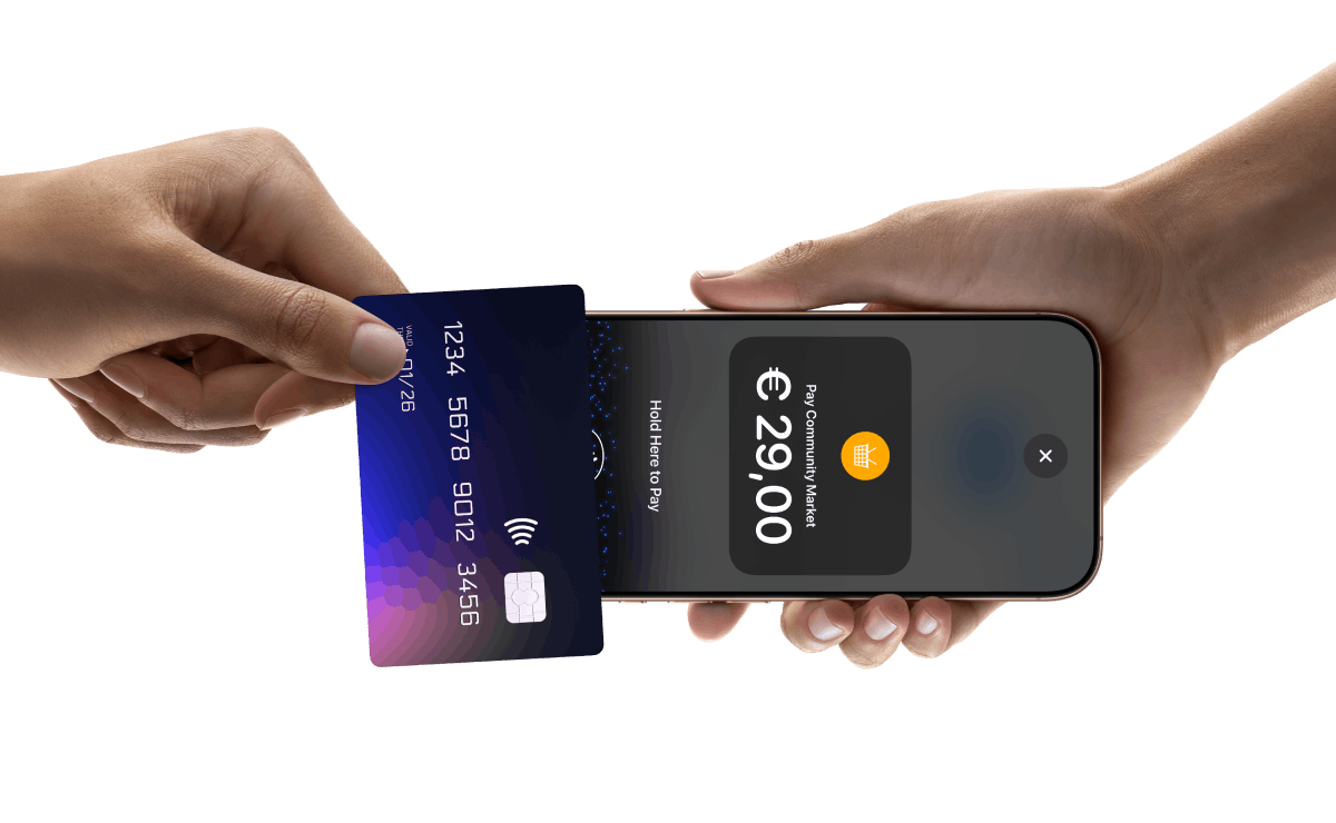 One hand holding an Iphone displaying a transaction in euros and another hand holding a card