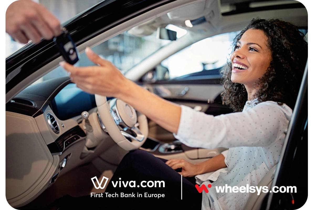 Smiling woman sitting in the driver's seat receiving keys from a rental service representative, showcasing a seamless car rental experience with integrated payment technology