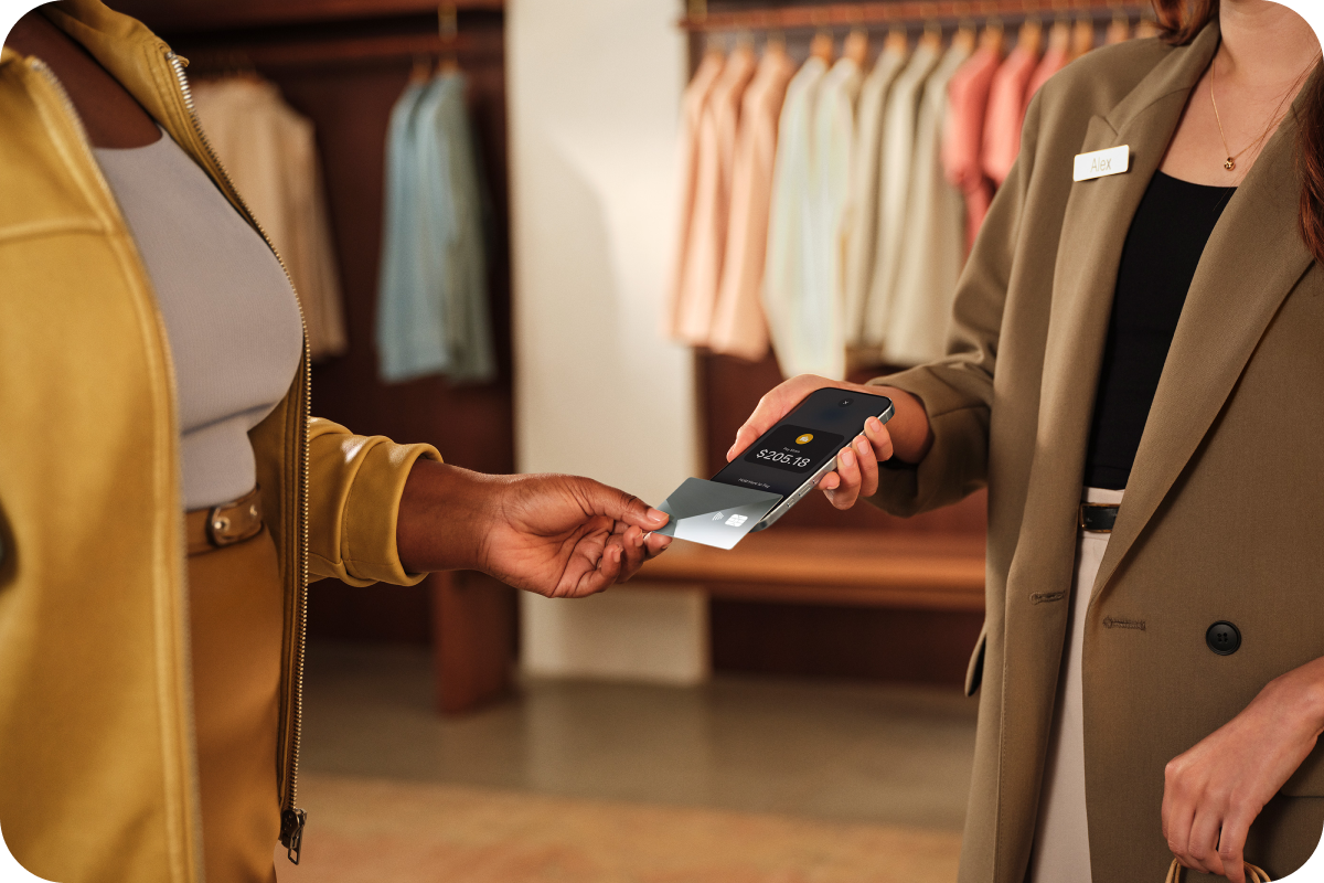Customer making a contactless card payment using Tap to Pay on iPhone at a retail store