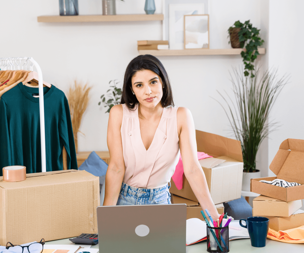 Small business owner managing remote payments and online orders from home workspace.