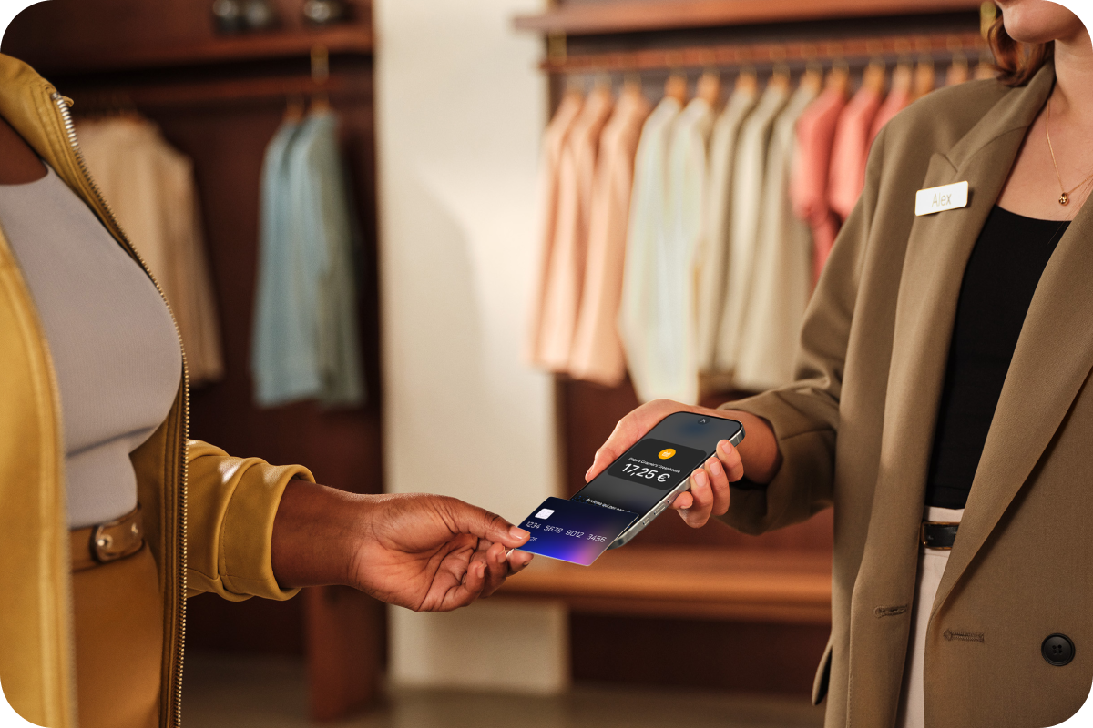 Customer making a contactless card payment using Tap to Pay on iPhone at a retail store