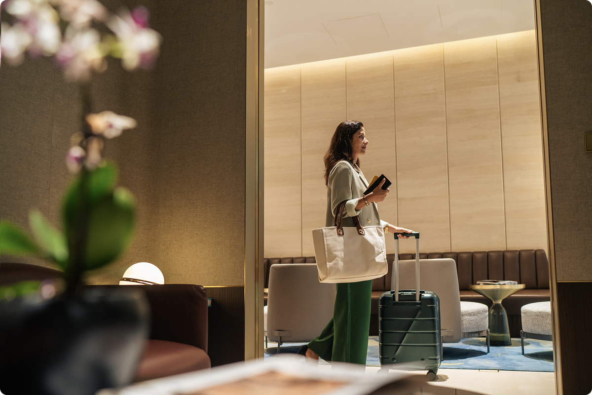 Hotel payment solutions for hospitality businesses — business traveller with luggage in a luxury hotel lobby, viva.com omnichannel payments