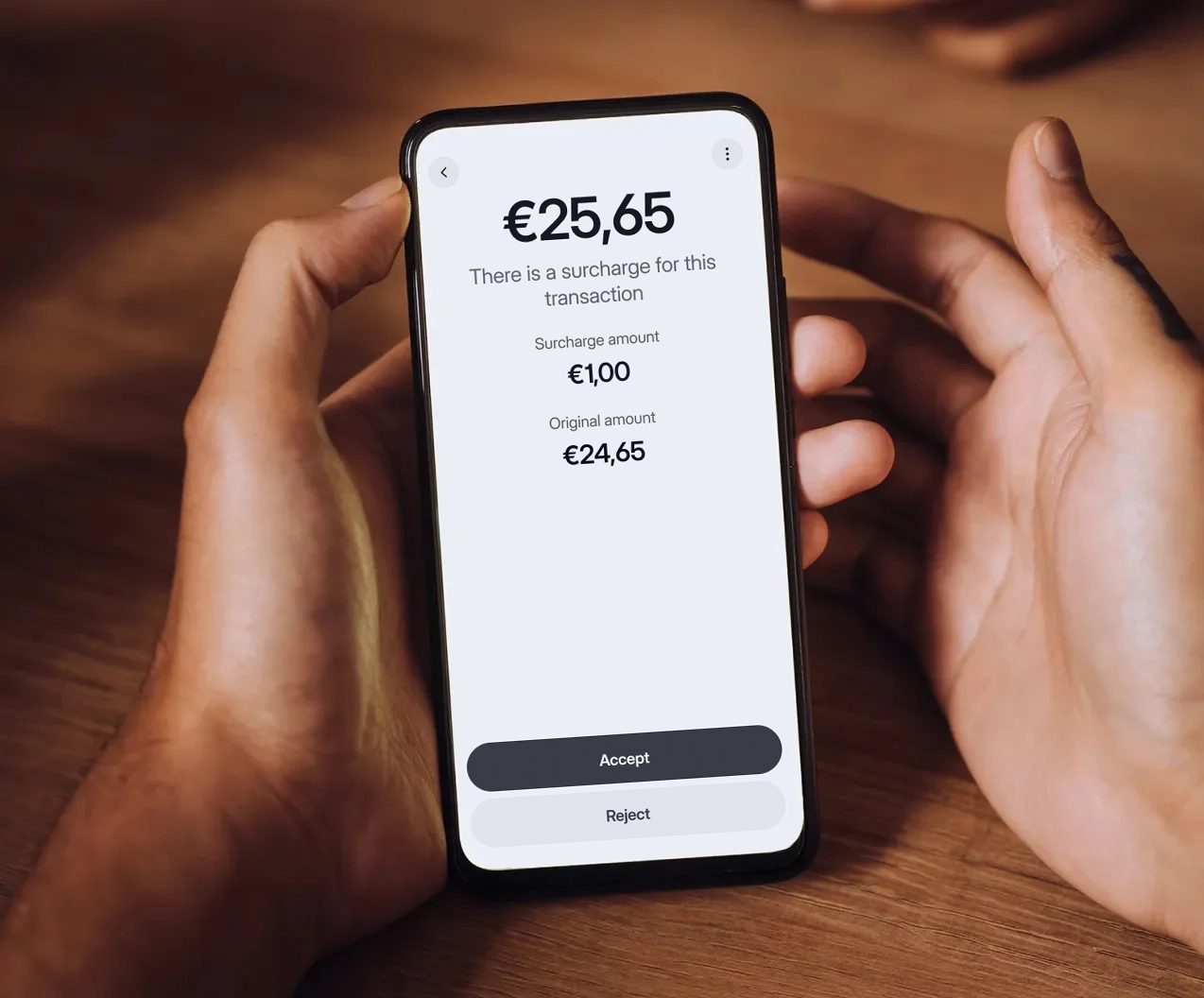 Customer reviewing and accepting a card payment surcharge on a smartphone before completing a secure card transaction with Viva.com Surcharge.