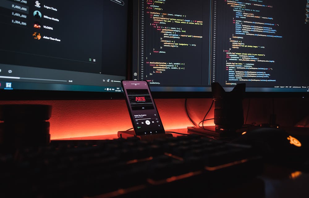 Desk with mobile phone and computer monitors