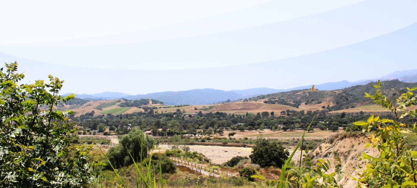 A view of the Ojai Valley with mountains in the distance