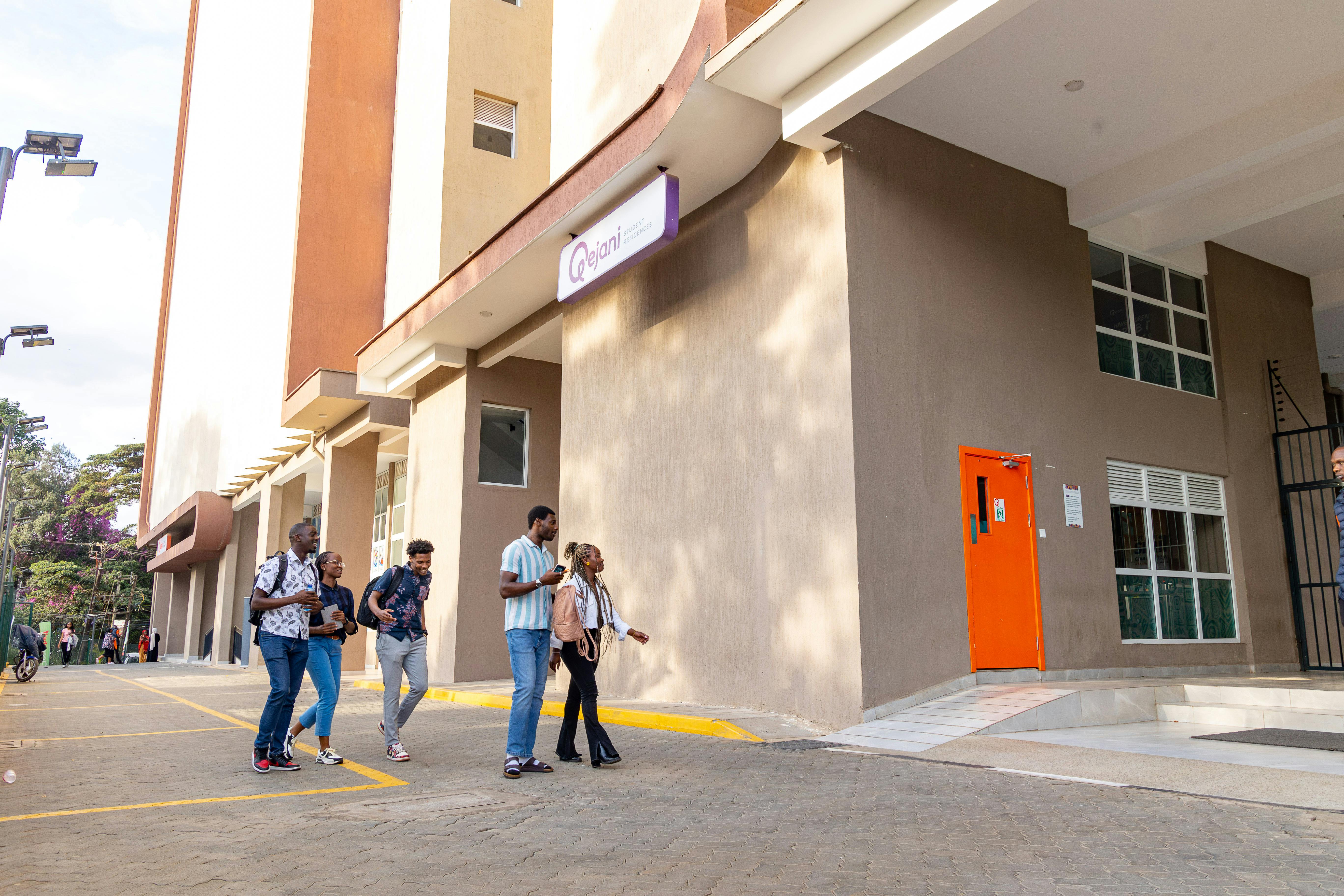 Students stepping into their student accommodation residence after their day at school.