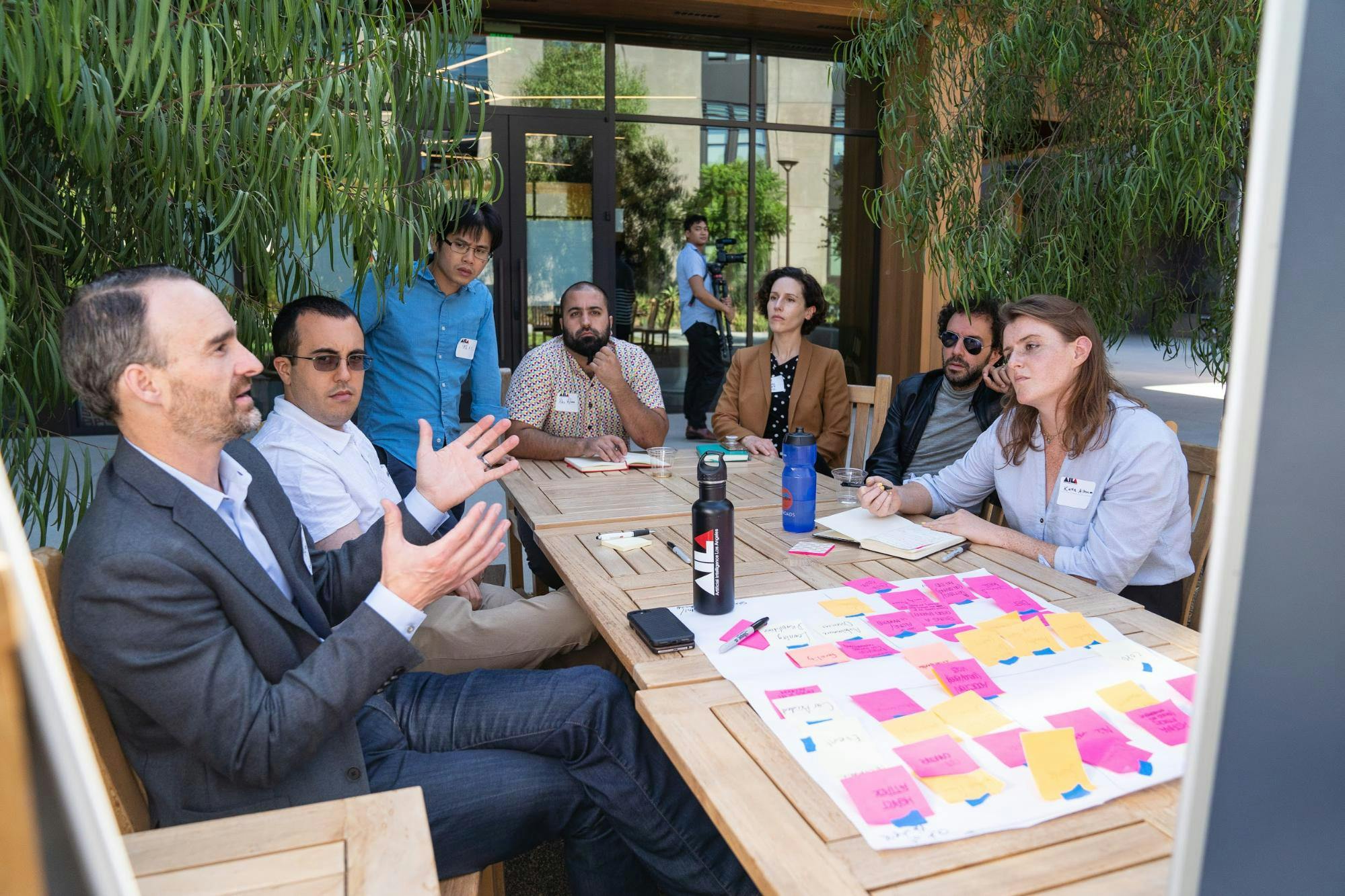 A group of people meets and exchanges ideas.