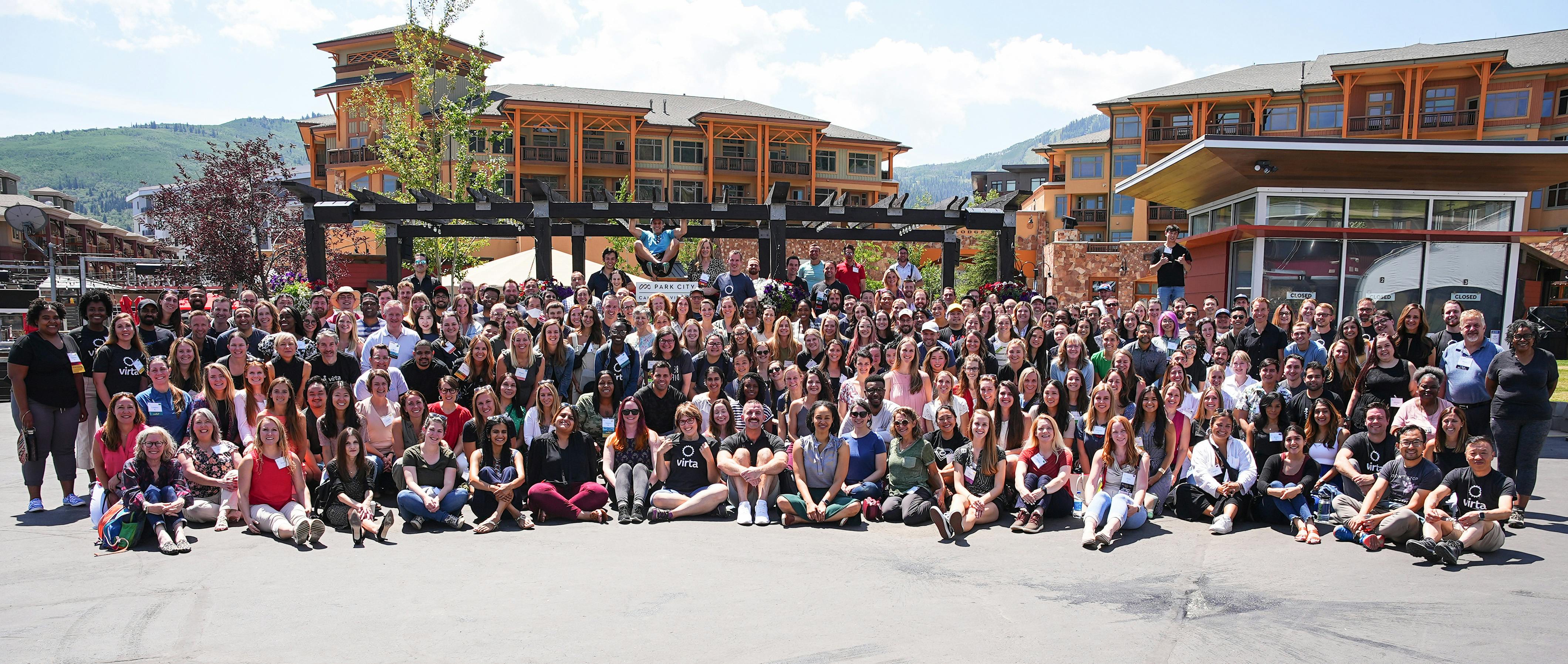 Virta company retreat with team members posing for group photo outside