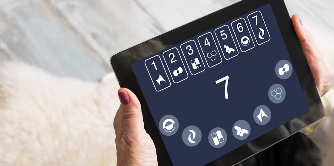 elderly person holding a tablet