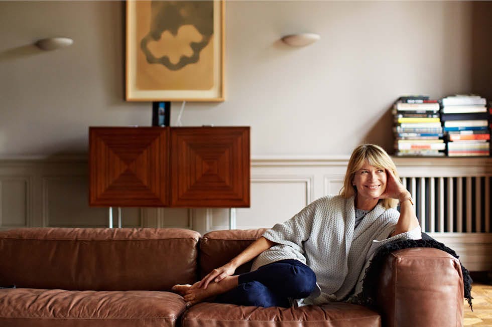 Women sitting on a leather couch