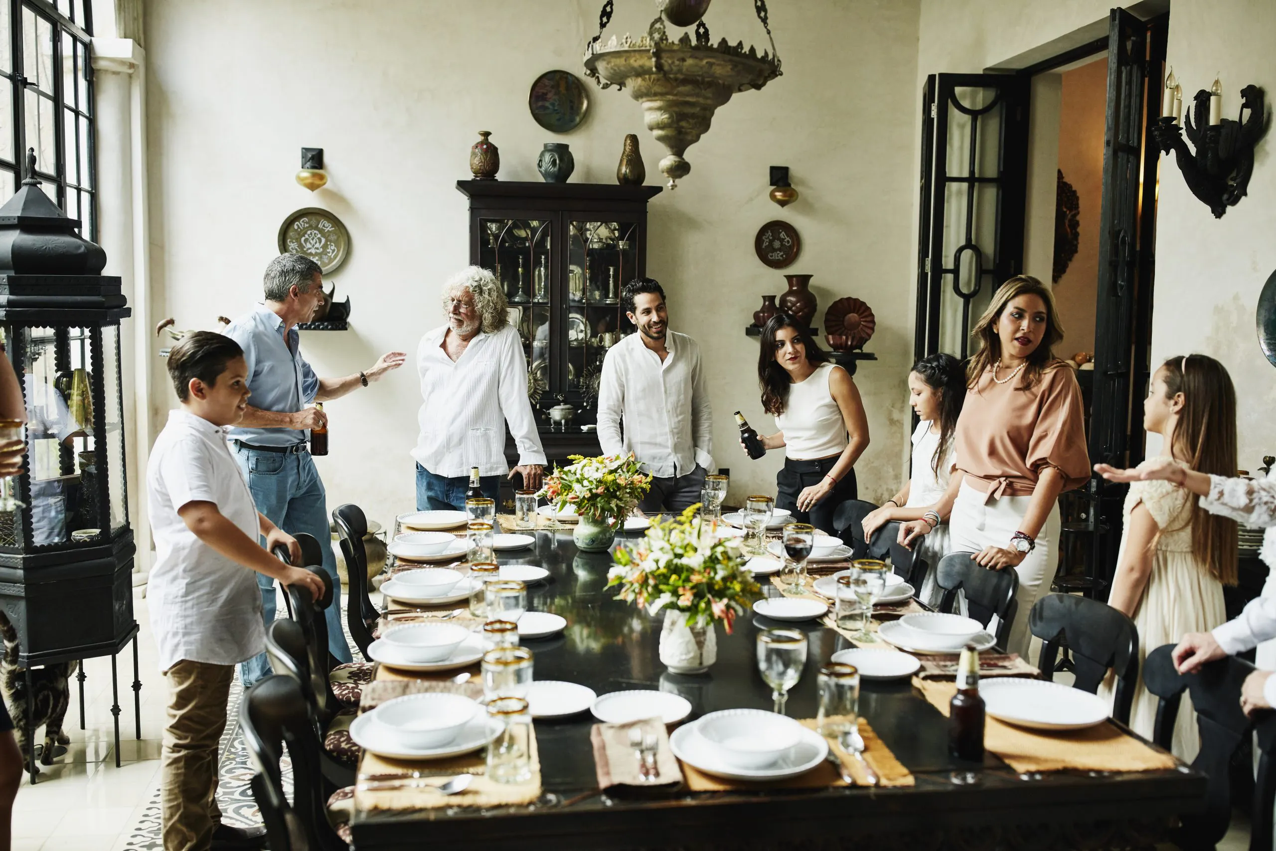 Multi-generational family around dinner table
