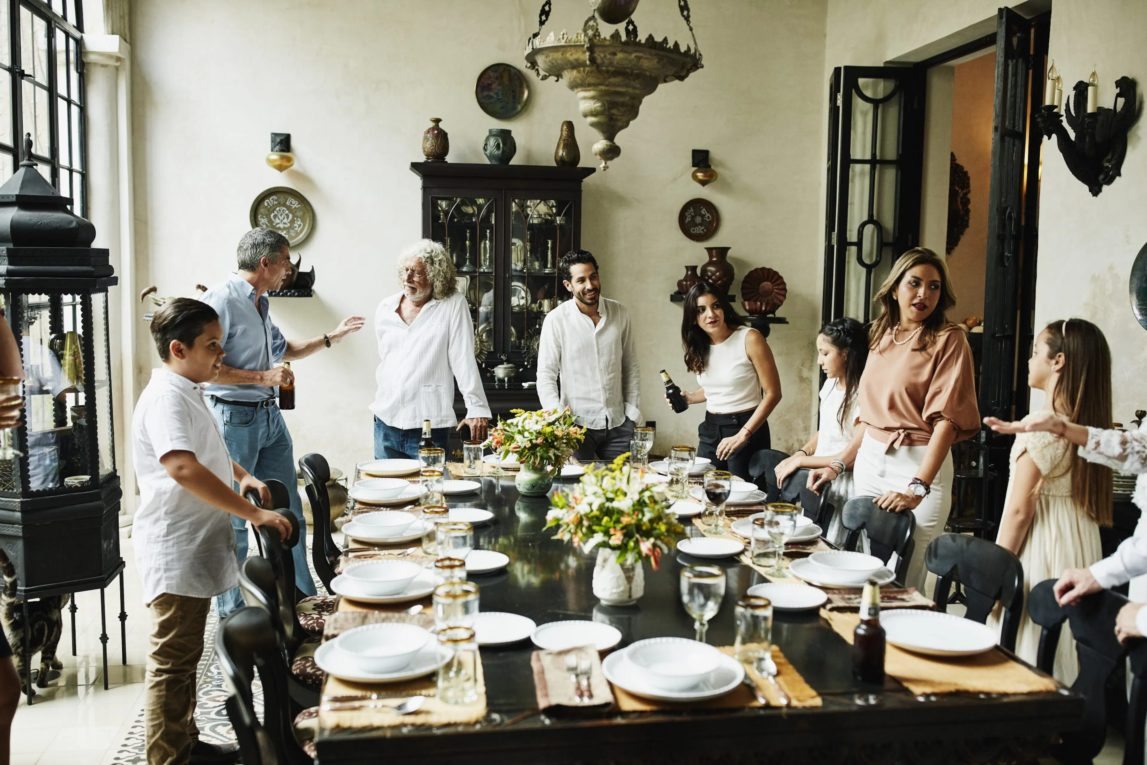 Multi-generational family around dinner table