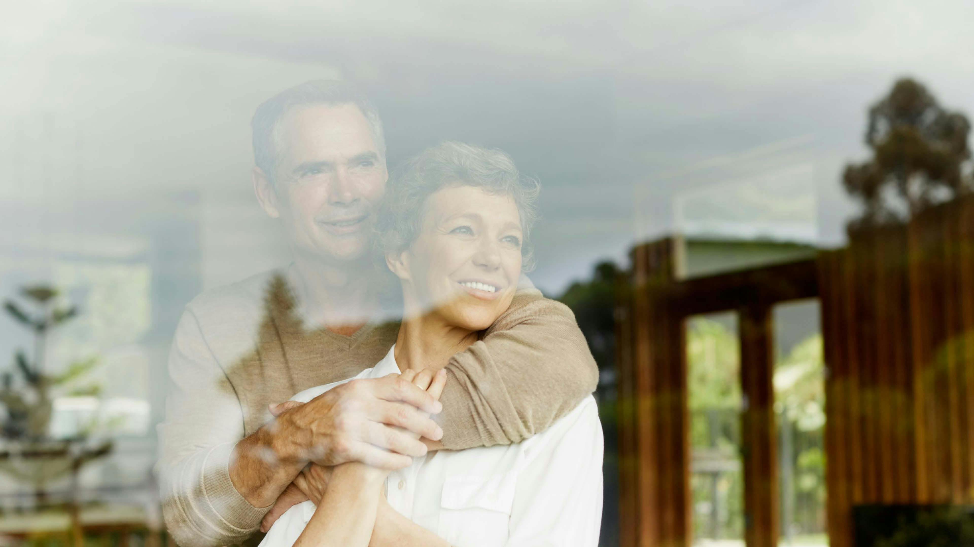 Mature couple looking at the window