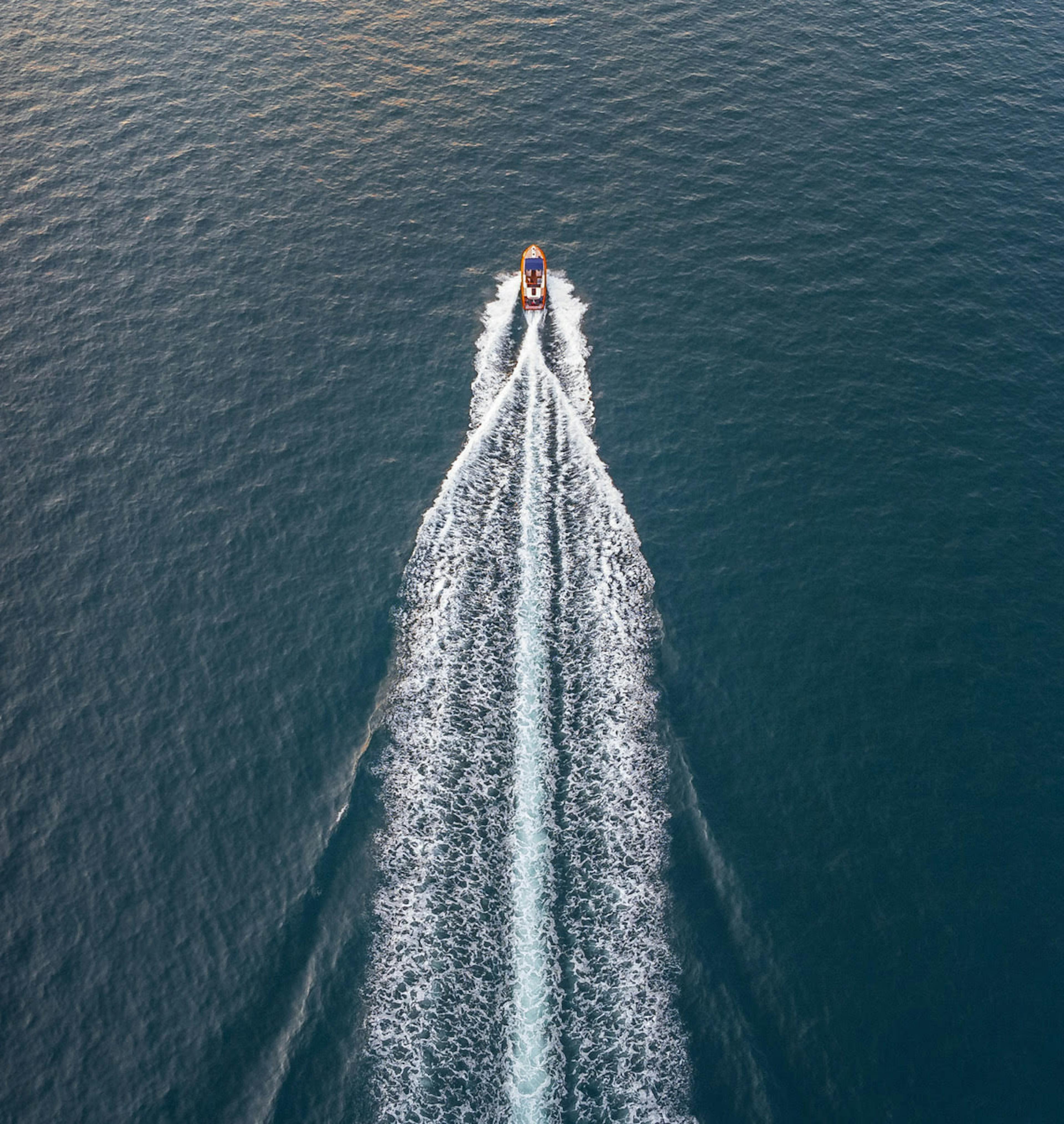 Boat speeding through ocean