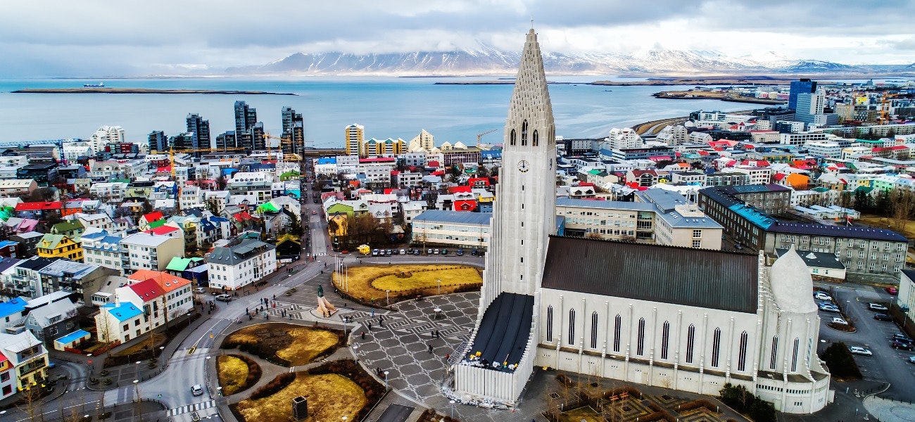 Aerial view of famous Hallgrimskirkja Cathedral and the city of Reykjavik in Iceland. Image taken with action drone camera