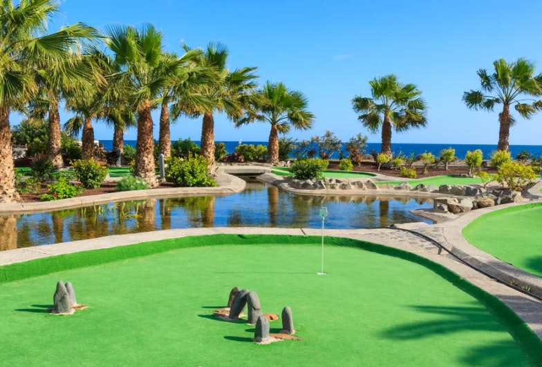 mini golf course in beautiful hotel Bahia de Grande gardens on coast of Fuerteventura island.