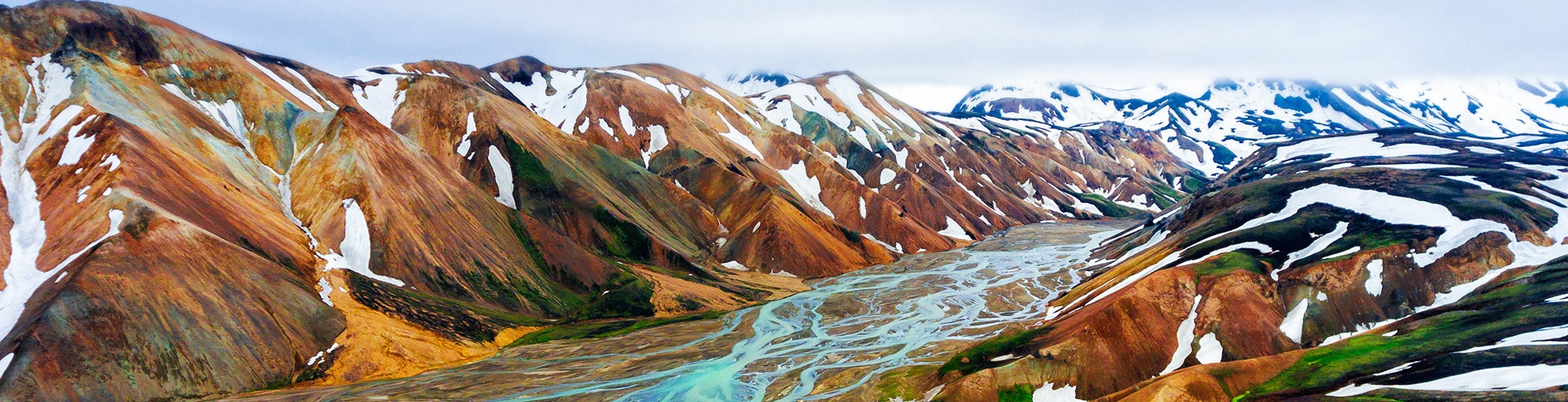 Colorful highlands of Iceland with snow-capped mountains