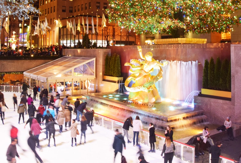 Locals and visitors skate under the Rockefeller Center Christmas tree in New York City