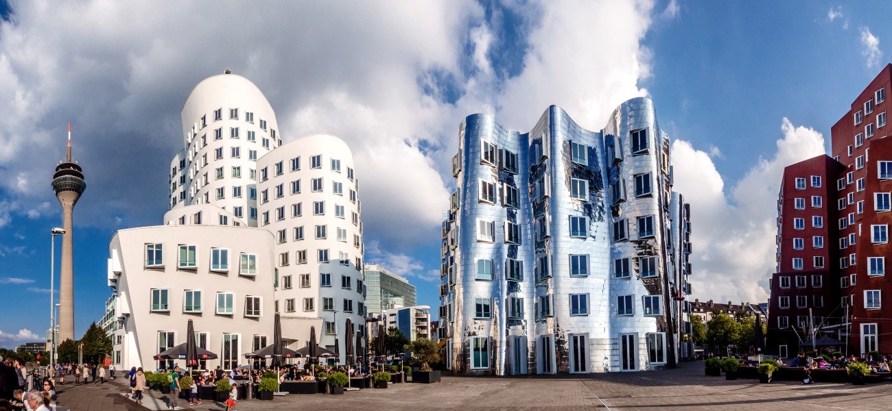 Panoramic view of three futuristic building Neue Zollhof located in Media Harbor.